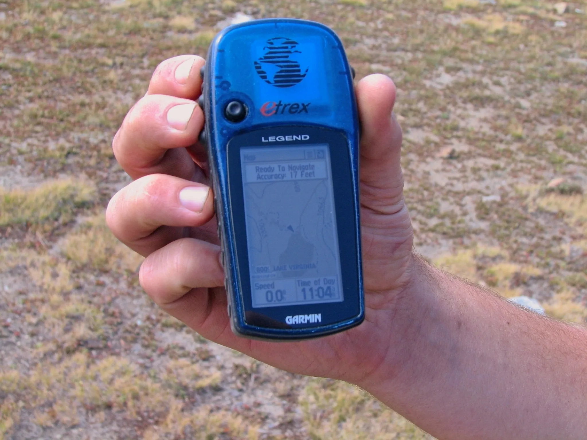 Handheld Garmin GPS showing Lake Virginia on the map during a backpacking trip.