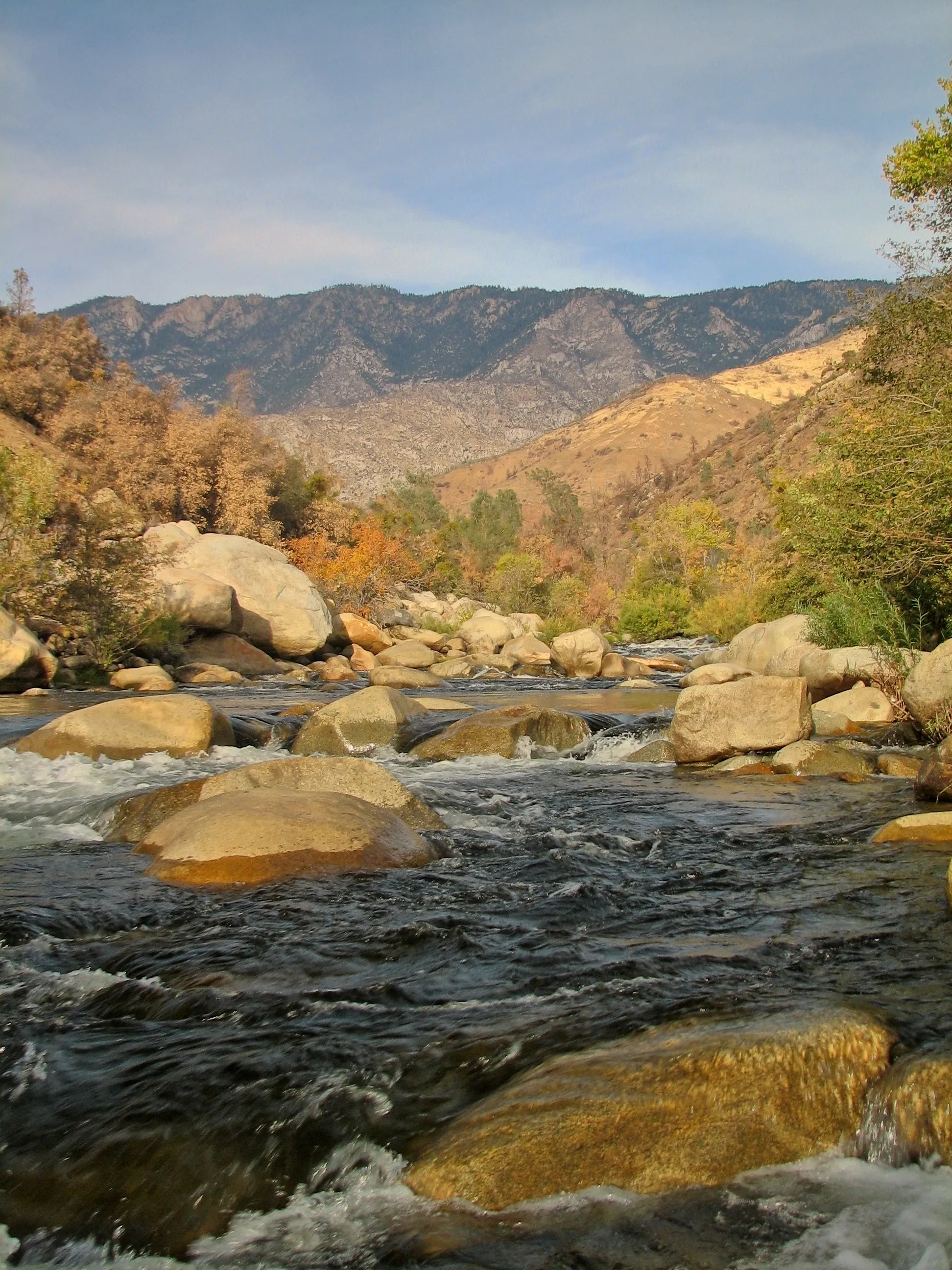 Kern River white water rushing over boulders in a mountain canyon.